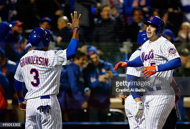 David Wright of the New York Mets celebrates with Curtis Granderson after hitting a two run home run in the first inning against the Kansas City...