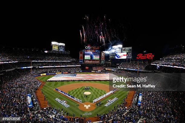 General view as a giant American Flag is displayed on the field prior to Game Three of the 2015 World Series at Citi Field between the New York Mets...