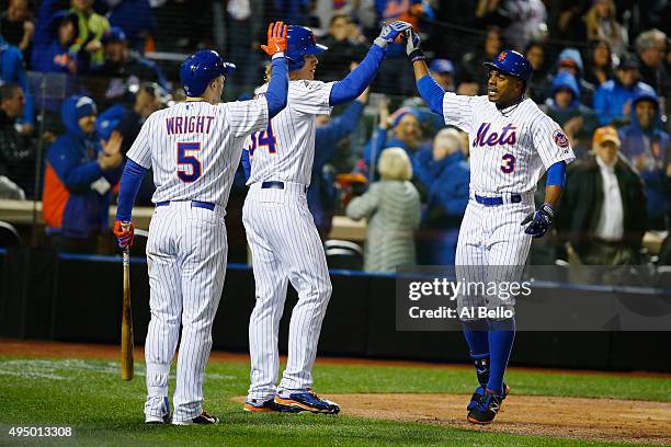 Curtis Granderson of the New York Mets celebrates with Noah Syndergaard and David Wright after hitting a two run home run in the third inning against...