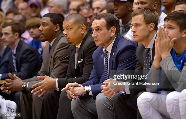 Duke Blue Devils coaches Nate James, Jeff Capel, head coach Mike Krzyzewski and Jon Scheyer watch during their game against the Florida Southern Mocs...