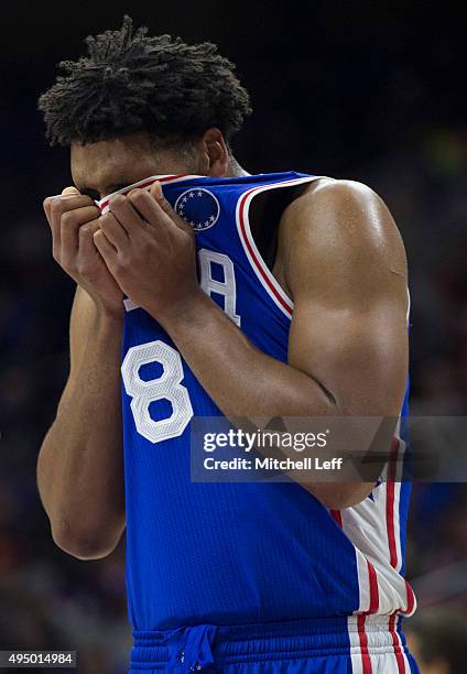 Jahlil Okafor of the Philadelphia 76ers wipes the sweat from his face during the game against the Utah Jazz on October 30, 2015 at the Wells Fargo...