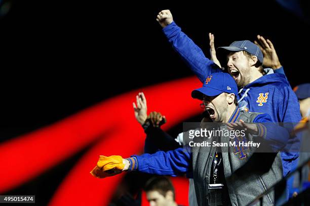 Fans cheers during Game Three of the 2015 World Series between the New York Mets and the Kansas City Royals at Citi Field on October 30, 2015 in the...