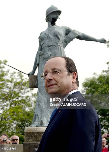 French President Francois Hollande stands in front of statue, a monument in tribute to soldiers who died during WWII, during a ceremony on June 1 in...