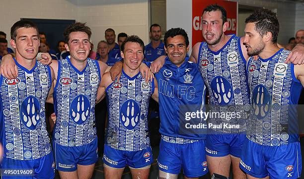 The Kangaroos sing their team song after winning the round 11 AFL match between the West Coast Eagles and the North Melbourne Kangaroos at Patersons...