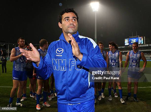 Lindsay Thomas of the Kangaroos leads his team from the field after winning the round 11 AFL match between the West Coast Eagles and the North...