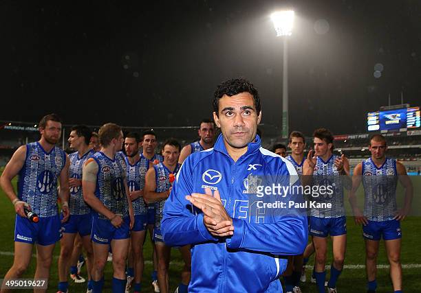 Lindsay Thomas of the Kangaroos leads his team from the field after winning the round 11 AFL match between the West Coast Eagles and the North...
