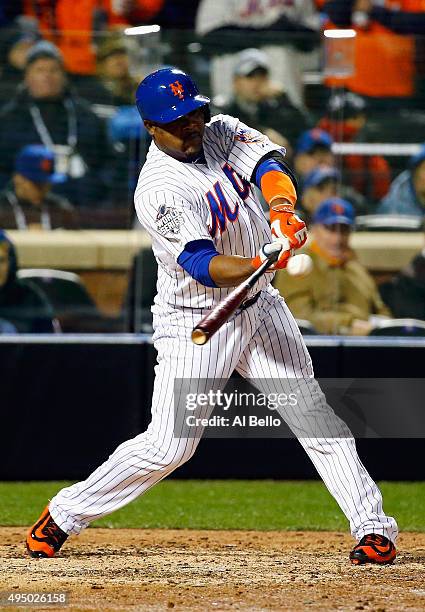 Juan Uribe of the New York Mets hits an RBI single in the sixth inning against the Kansas City Royals during Game Three of the 2015 World Series at...