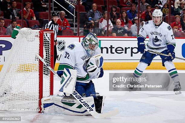 Goaltender Richard Bachman of the Vancouver Canucks makes a save on a shot from the Arizona Coyotes during the first period of the NHL game at Gila...
