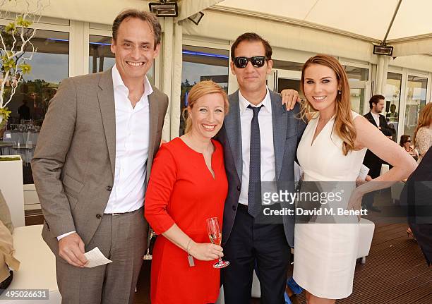 Andre Konsbruck, Director of Audi UK, Christine Sieg, Clive Owen and Tonya Meli attend day two of the Audi Polo Challenge at Coworth Park Polo Club...