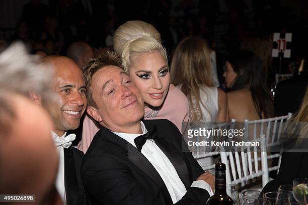 Bryan Lourd and Kevin Huvane of CAA pose for a photo with Lady Gaga at the amfAR Inspiration Gala at Milk Studios on October 29, 2015 in Hollywood,...