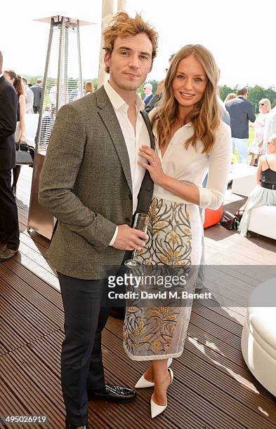 Sam Claflin and Laura Haddock attend day two of the Audi Polo Challenge at Coworth Park Polo Club on June 1, 2014 in Ascot, England.
