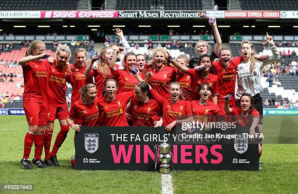 Olivia Fuller and her Liverpool Ladies team celebrate with the trophy during the FA Girl's Youth Cup final between Everton Ladies and Liverpool...