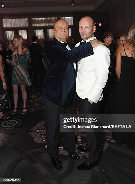 Chairman of the Board of BAFTA LA Nigel Daly and actor Andrew Howard attend the 2015 Jaguar Land Rover British Academy Britannia Awards presented by...