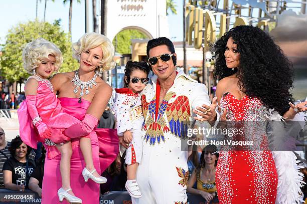 Charissa Thompson, Gia Lopez, Nico Lopez, Mario Lopez and Tracey Edmonds attend "Extra" at Universal Studios Hollywood on October 30, 2015 in...