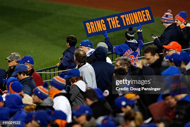 Fans cheers during Game Three of the 2015 World Series between the New York Mets and the Kansas City Royals at Citi Field on October 30, 2015 in the...