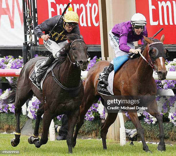 Jockey Dwayne Dunn riding Excess Knowledge wins against Damian Lane riding Zanteca in race 5 The Lexus Stakes on Derby Day at Flemington Racecourse...