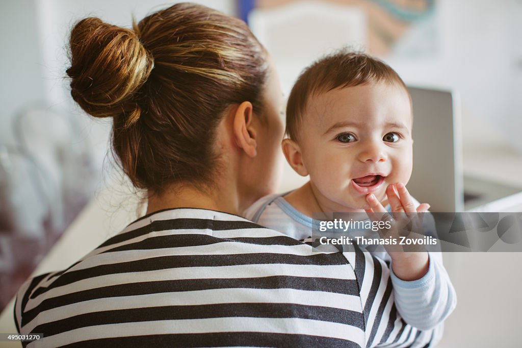 Mother with her infant child at home