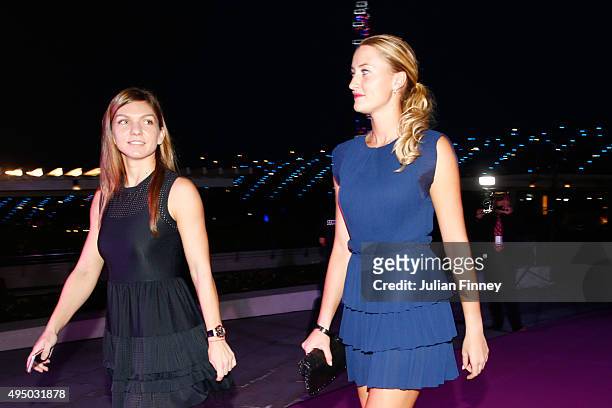 Simona Halep and Kristina Mladenovic attend Singapore Tennis Evening during BNP Paribas WTA Finals at Marina Bay Sands on October 30, 2015 in...