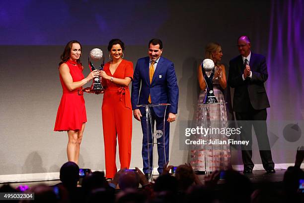 Martina Hingis, Sania Mirza and Dubai Duty Free Tennis Tournament director Salah Tahlak on stage at Singapore Tennis Evening during BNP Paribas WTA...