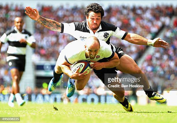 Anthony Tuitavake of the Barbarians fails to stop Charlie Sharples of England going over to score a try during the Rugby Union International Match...