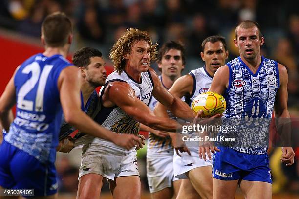 Matt Priddis of the Eagles handballs during the round 11 AFL match between the West Coast Eagles and the North Melbourne Kangaroos at Patersons...