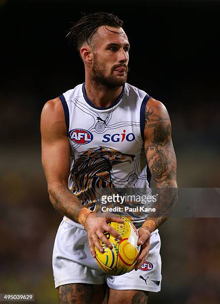 Chris Masten of the Eagles looks to pass the ball during the round 11 AFL match between the West Coast Eagles and the North Melbourne Kangaroos at...