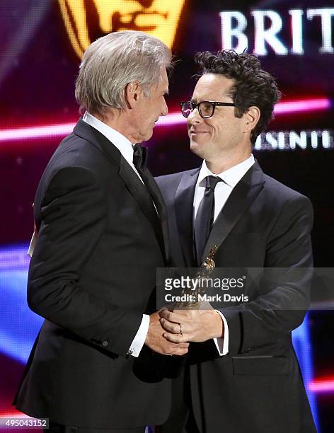 Honoree Harrison Ford accepts the Albert R. Broccoli Britannia Award for Worldwide Contribution to Entertainment from director J.J. Abrams onstage...