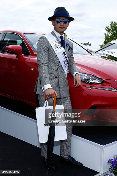 Myer Fashions on the Field Men's Racewear winner Pepe Sithiphon Siyavong poses on Victoria Derby Day at Flemington Racecourse on October 31, 2015 in...