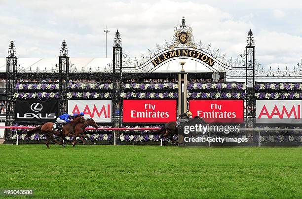 Dwayne Dunn riding Excess Knowledge defeats Damian Lane riding Zanteca in Race 5, the Lexus Stakes on Derby Day at Flemington Racecourse on October...