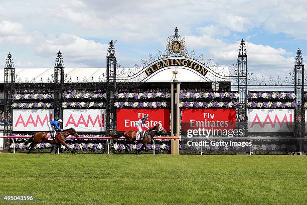 Jockey Craig Newitt riding Tarzino wins race 7 The AAMI Victorian Derby on Derby Day at Flemington Racecourse on October 31, 2015 in Melbourne,...