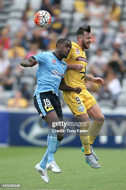 Roy O'Donovan of the Mariners contests the ball with Jacques Faty of Sydney FC during the round four A-League match between the Central Coast...