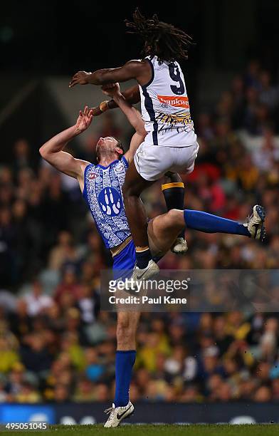 Todd Goldstein of the Kangaroos and Nic Naitanui of the Eagles contest the ruck during the round 11 AFL match between the West Coast Eagles and the...