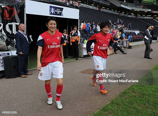 Shinobu Ohno and Yukari Kinga of Arsenal walk out of the players tunnel before the match at Stadium mk on June 1, 2014 in Milton Keynes, England.