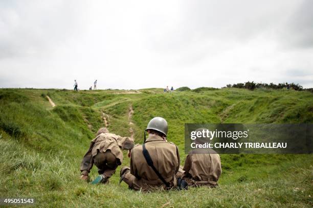 Children dressed as soldiers visit La Pointe du Hoc on May 31, 2014 in Cricqueville-en-Bessin, northwestern France, site of a former observation post...