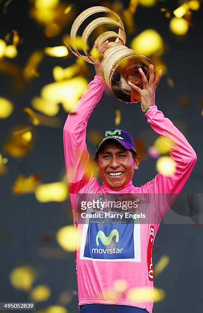 Nairo Quintana of Colombia and team Movistar lifts the winners trophy, the 'Trofeo Senza Fine', following the twenty-first stage of the 2014 Giro...