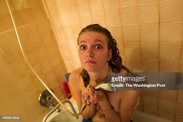 Morgan Brittany is assisted with the ritual of bathing by her cousin Hannah Terry as she recovers from an heroin overdose at her grandparent's home...