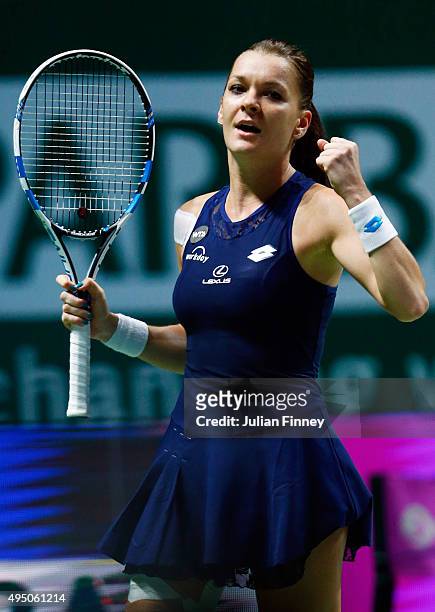 Agnieszka Radwanska of Poland celebrates match point at the semi-final match against Garbine Muguruza of Spain during BNP Paribas WTA Finals at...