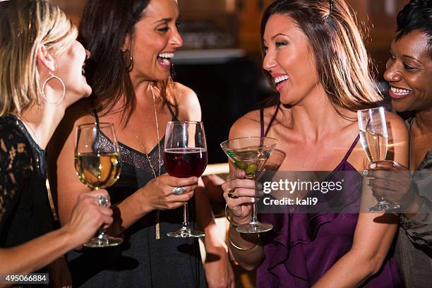 ladies night out, having fun at a bar - cocktail party dress stock pictures, royalty-free photos & images