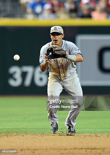 Everth Cabrera of the San Diego Padres makes a play on a bouncing ball against the Arizona Diamondbacks at Chase Field on May 26, 2014 in Phoenix,...