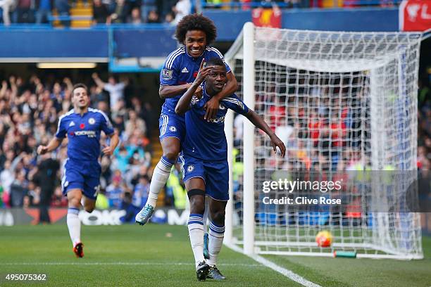 Ramires of Chelsea celebrates scoring his team's first goal with his team mate Willian during the Barclays Premier League match between Chelsea and...