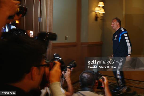 Japan head coach Alberto Zaccheroni leaves the room after a press conference at the Hyatt Regency Clearwater Beach Resort and Spa on June 1, 2014 in...