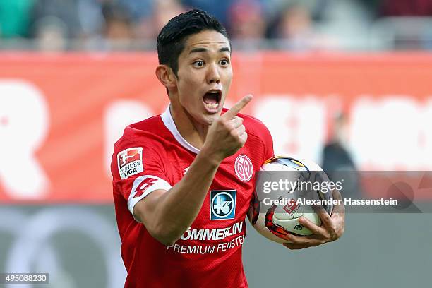 Yoshinori Muto of Mainz celebrates scoring the opening goal during the Bundesliga match between FC Augsburg and 1. FSV Mainz 05 at WWK Arena on...