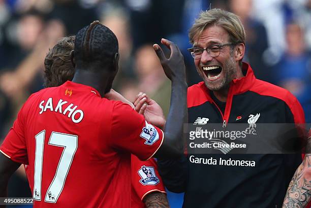 Jurgen Klopp , manager of Liverpool celebrates his team's 3-1 win with his player Mamadou Sakho after the Barclays Premier League match between...