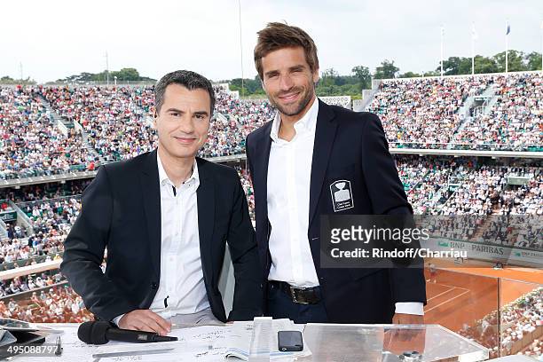 Sports journalist Laurent Luyat and French Davis Cup captain Arnaud Clement pose at France Television french chanels studio whyle the Roland Garros...