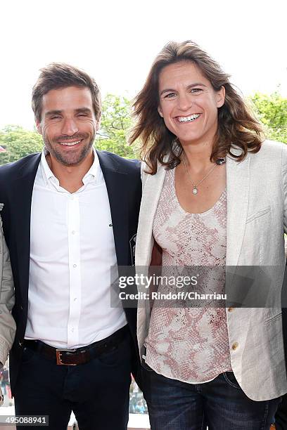 French Davis Cup Arnaud Clement and Roland Garros TV host for France Television and French Fed Cup captain Amelie Mauresmo pose at France Television...