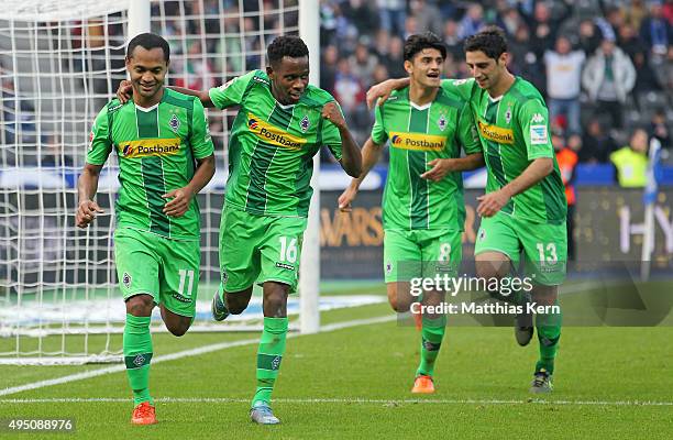 Raffael of Moenchengladbach jubilates with his team mates Ibrahima Traore, Mahmoud Dahoud and Lars Stindl after scoring the second goal during the...