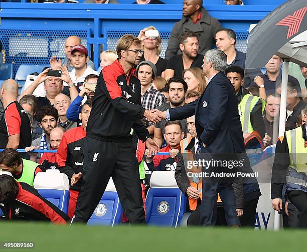 Jurgen Klopp manager of Liverpool shakes hands with Jose Mourinho manager of Chelsea at the end of the Barclays Premier League match between Chelsea...