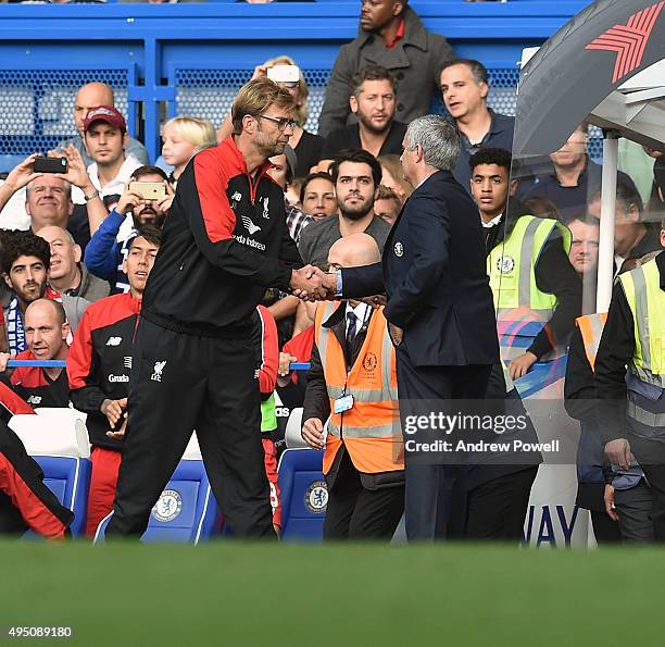 Jurgen Klopp manager of Liverpool shakes hands with Jose Mourinho manager of Chelsea at the end of the Barclays Premier League match between Chelsea...