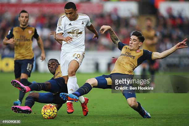 Jefferson Montero of Swansea City vies for the ball with Joel Campbell and Hector Bellerin of Arsenal during the Barclays Premier League match...