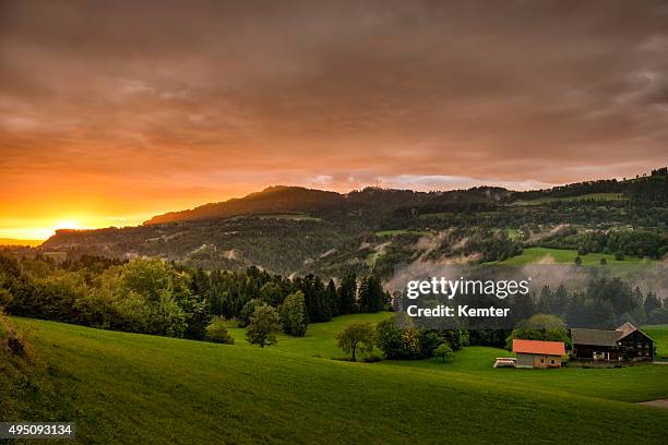 sunset after a rainy day - vorarlberg stock pictures, royalty-free photos & images